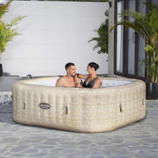 Couple enjoying Lay-Z-Spa Tuscany Airjet Hot Tub.