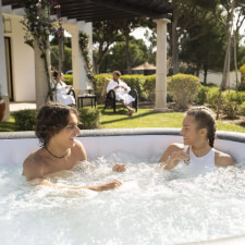 People enjoying Lay-Z-Spa Mauritius AirJet Hot Tub.