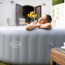 Woman enjoying the Lay-Z-Spa Grenada AirJet Hot Tub.