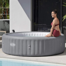 Woman enjoying the Lay-Z-Spa Grenada AirJet Hot Tub.