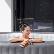 Woman enjoying the Lay-Z-Spa Grenada AirJet Hot Tub.