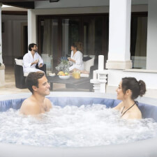 Couple enjoying the Lay-Z-Spa Santorini Hydrojet Pro Hot Tub Bubbles.