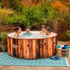 Family enjoying the Lay-Z-Spa Helsinki AirJet Hot Tub.