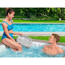 Couple using the Lay-Z-Spa Hot Tub Seat.
