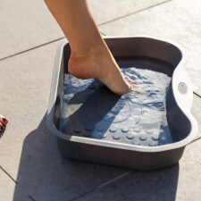 Woman using the Lay-Z-Spa Hot Tub Footbath.