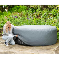 The Circular Round Thermal Hot Tub Cover being placed