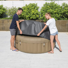 The Circular Round Thermal Hot Tub Cover being placed
