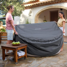 The Circular Round Thermal Hot Tub Cover being Placed.