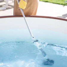 The Lay-Z-Spa Rechargeable Underwater Vacuum In Use.