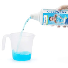 Pouring the Lay-Z-Spa Clearwater Algaecide .