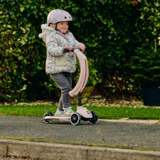 A Kid Riding The Ride-Ezy Kick & Go Ride On & Scooter.