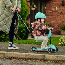 A Kid Riding The Ride-Ezy Kick & Go Ride On & Scooter.