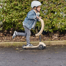 A Kid Riding The Ride-Ezy Kick & Go Ride On & Scooter.