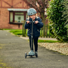 A Kid Riding The Ride-Ezy Kick & Go Ride On & Scooter.