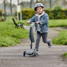 A Kid Riding The Ride-Ezy Kick & Go Ride On & Scooter.
