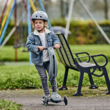 A Kid Riding The Ride-Ezy Kick & Go Ride On & Scooter.