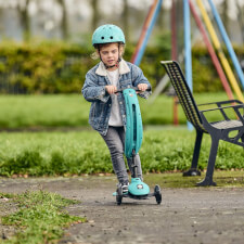 A Kid Riding The Ride-Ezy Kick & Go Ride On & Scooter.