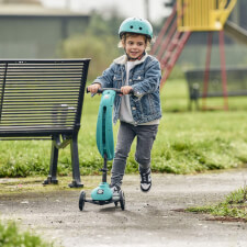 A Kid Riding The Ride-Ezy Kick & Go Ride On & Scooter.