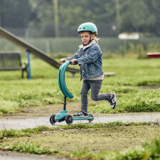 A Kid Riding The Ride-Ezy Kick & Go Ride On & Scooter.