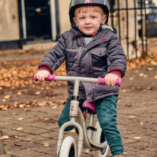 A Kid Riding the Ride-Ezy Go Balance Bike.