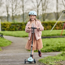 A Kid Riding the Ride-ezy Kick 3-Wheel Scooter.