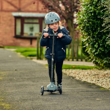 A Kid Riding the Ride-ezy Kick 3-Wheel Scooter.