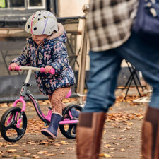 A Kid Riding the Ride-ezy Go Glo Balance Bike.