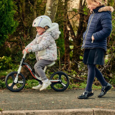 A Kid Riding the Ride-ezy Go Glo Balance Bike.