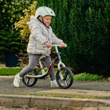 A Kid Riding the Ride-ezy Go Glo Balance Bike.