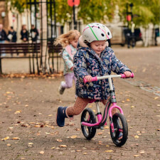 A Kid Riding the Ride-ezy Go Glo Balance Bike.