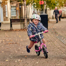 A Kid Riding the Ride-ezy Go Glo Balance Bike.