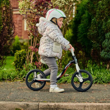 A Kid Riding the Ride-ezy Go Glo Balance Bike.