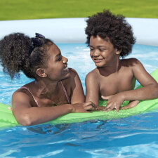 Family enjoying the Rattan Fast Set Pool.