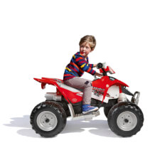 Kid enjoying Polaris Outlaw 330W Ride On Motorbike in Red.