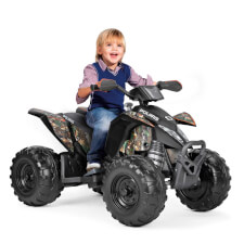 Kid enjoying Polaris Outlaw 330W Ride On Motorbike in Camo.