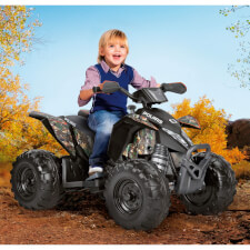 Kid enjoying Polaris Outlaw 330W Ride On Motorbike in Camo.