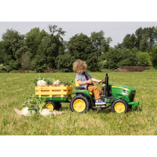Kid Riding John Deere Ground Force Ride On Tractor.