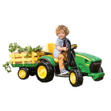 Kid Riding John Deere Ground Force Ride On Tractor.