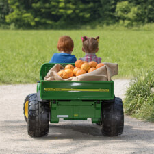 Kids riding Peg Perego John Deere Gator HPX Ride On Vehicle.