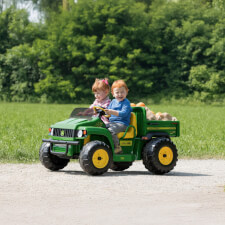 Kids riding Peg Perego John Deere Gator HPX Ride On Vehicle.