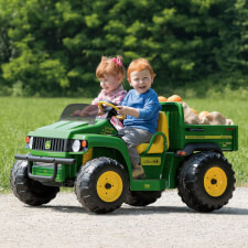 Kids riding Peg Perego John Deere Gator HPX Ride On Vehicle.