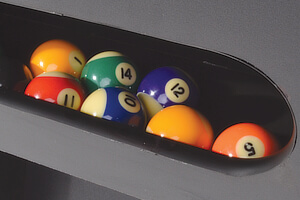 The ball return system on a Strikeworth pool table.
