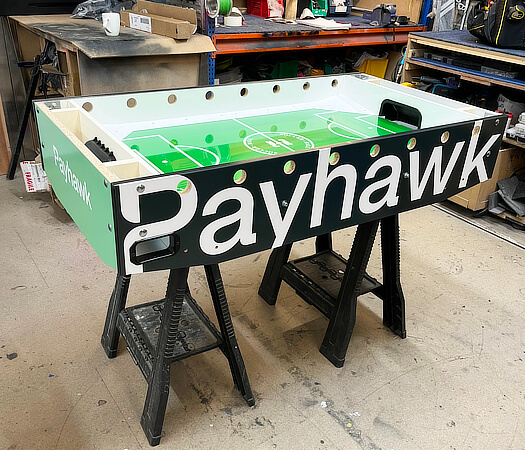 A custom football table being created.