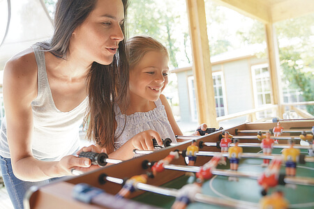 Playing foosball at a holiday park.